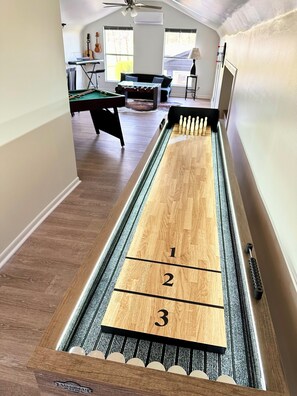 Game room with new shuffle board with bowling option, bumper pool, and fooseball