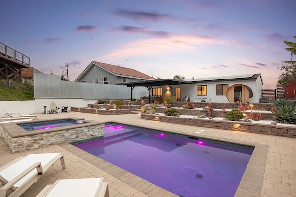 Backyard with pool, hot tub, sauna, and cold plunge