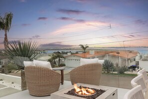 Front deck with 180° views of Mission Bay, fire pit, BBQ, dining table, seating