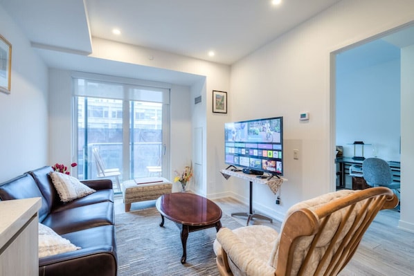 Cozy living space with a smart TV & comfy seating.