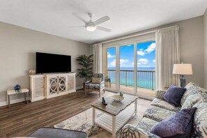 Living room with a queen sleeper sofa, flat-screen smart TV, and stunning views.