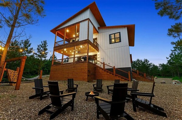 Outdoor Space: Relax by the fire pit under twinkling lights and surrounded by nature's beauty!