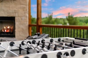 Game Lounge: Enjoy friendly competition by the fireplace with stunning sunset views!