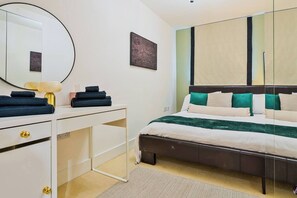 Cozy bedroom with a comfortable bed, perfect for a restful night’s sleep.