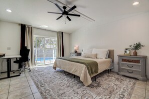 Wake up to sunshine, style, and poolside views—your perfect bedroom escape.