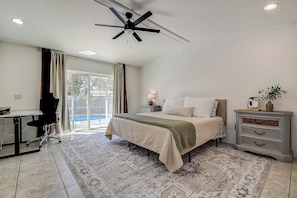 Wake up to sunshine, style, and poolside views—your perfect bedroom escape.