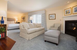 A spacious and elegantly designed suite, perfect for unwinding by the fire in absolute comfort.