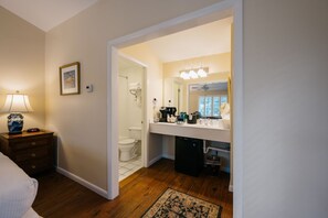 A thoughtfully designed space with seamless access to a well-appointed bathroom.
