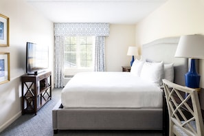 Serene bedroom featuring a luxurious bed, soft natural light, and stylish furnishings for restful nights.