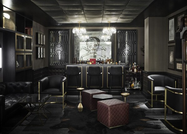 An intimate lounge with timeless elegance, where rich textures, dim lighting, and refined décor set the mood.