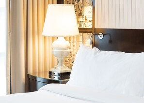Soft lighting and luxurious bedding, where elegance meets total comfort for a serene stay.