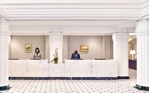 A grand entrance with classic sophistication, where marble finishes and warm service create a welcoming arrival.