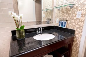 Sophisticated bathroom with modern touches, featuring sleek countertops and elegant décor.