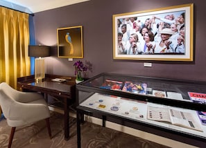 A workspace with character, blending modern design with curated artwork for an inspiring setting.