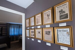 A hallway rich in history, featuring framed newspaper covers that tell captivating stories of the past.