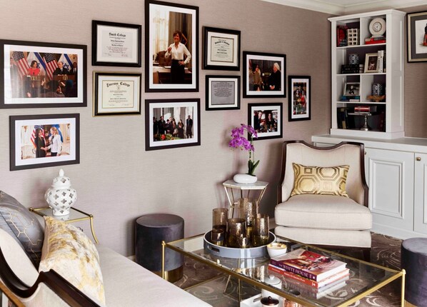 A space that tells a story, featuring a gallery wall of achievements and cherished moments.