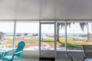 Relax in the sunroom and take in the beautiful view of our private dock.