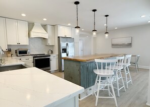 Spacious kitchen includes coffee maker, toaster oven and microwave.
