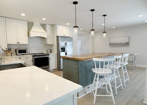 Spacious kitchen includes coffee maker, toaster oven and microwave.
