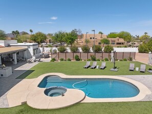 Relax by the pool, spa & loungers in a spacious, private backyard escape.