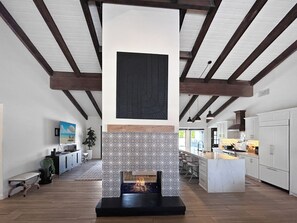 Double-sided fireplace adds style to the open living and kitchen area.
