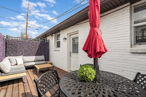 Private patio featuring outdoor seating and a dining area with seating for 4 guests