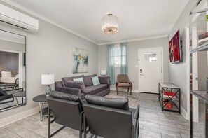 Open-floor living space featuring a Smart TV and cozy furnishings.