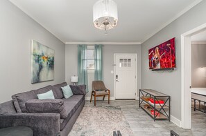 Open-floor living space featuring a Smart TV and cozy furnishings.