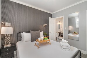 Primary Bedroom featuring a Queen bed, closet, and Jack n Jill style bathroom.