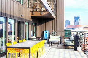 Private patio with lots of seating and views of the Nashville skyline