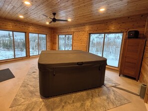 Hot tub room-AMAZING views. Accessible through main level bedroom and porch.