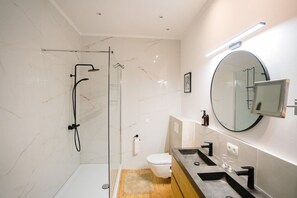 Modern bathroom with rain shower and toilet