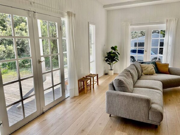 Cosy lounge with direct access to decking outside