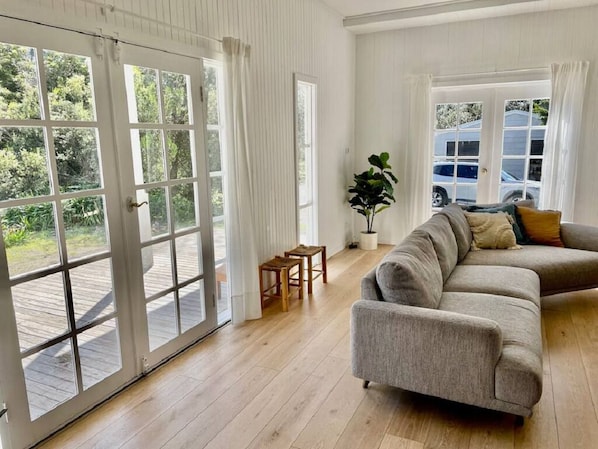 Cosy lounge with direct access to decking outside