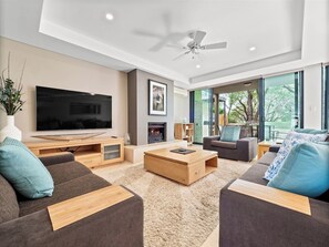 Bright and spacious indoor living with gas fireplace and seamless flow to the outdoor alfresco.