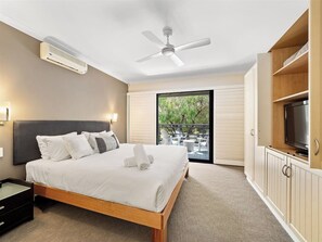 Unwind in the luxe king suite with balcony access and a spa-style ensuite featuring a soaking tub.