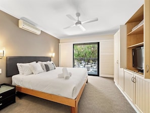 Unwind in the luxe king suite with balcony access and a spa-style ensuite featuring a soaking tub.