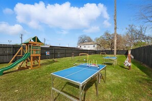 “Games Galore in the Backyard”
From ping pong and mini soccer to cornhole and a full playset, the shared backyard is packed with activities to keep both kids and adults entertained.