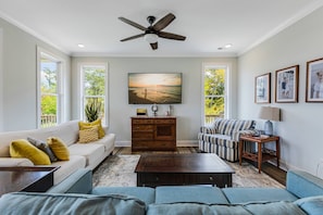 Cozy living area featuring comfortable sofas and chairs, perfect for relaxing and unwinding