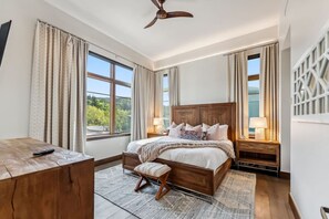 Primary bedroom with king bed, smart TV and en-suite bathroom
