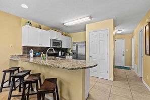 Spacious kitchen with bar seating