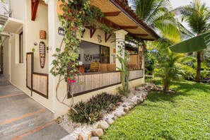 The covered front terrace offers an amazing space to relax, dine, work, or play!