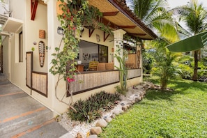 The covered front terrace offers an amazing space to relax, dine, work, or play!