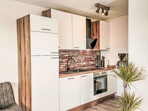 Wood, Interior Design, Flooring, Cabinetry, Kitchen, Floor, Apartment, Furniture, Home, Kitchen Appliance