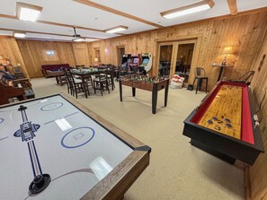 Unleash your competitive spirit in this fun-filled space, complete with air hockey and more!