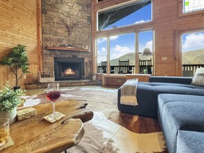 Enjoy stunning mountain views by the fireplace while sipping your favorite wine!