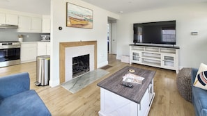 Living room with comfortable seating and flat screen TV