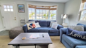 Living room with comfortable seating and flat screen TV
