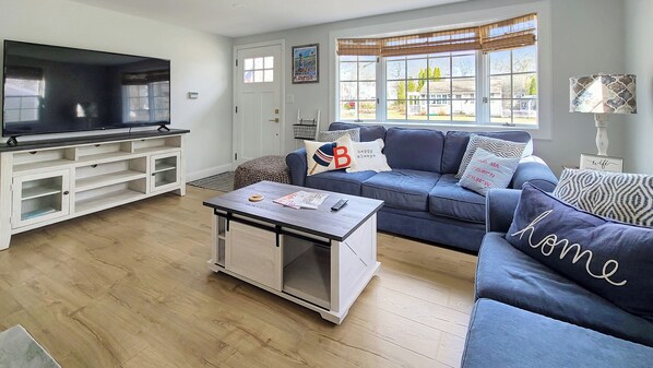Living room with comfortable seating and flat screen TV
