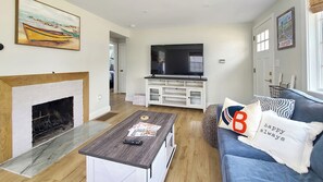 Living room with comfortable seating and flat screen TV